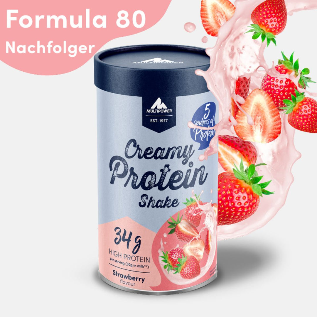 Multipower Creamy Protein Shake in der Geschmacksrichtung Erdbeere – 420g Dose mit pink-blauem Etikett, stehend auf hellem Untergrund.